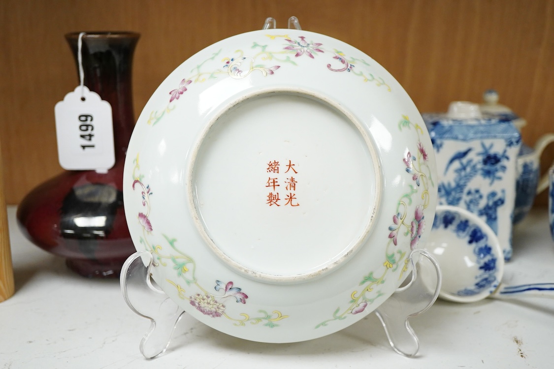 A Chinese famille rose and green ground dish decorated with birds amongst flowers, 17cm in diameter